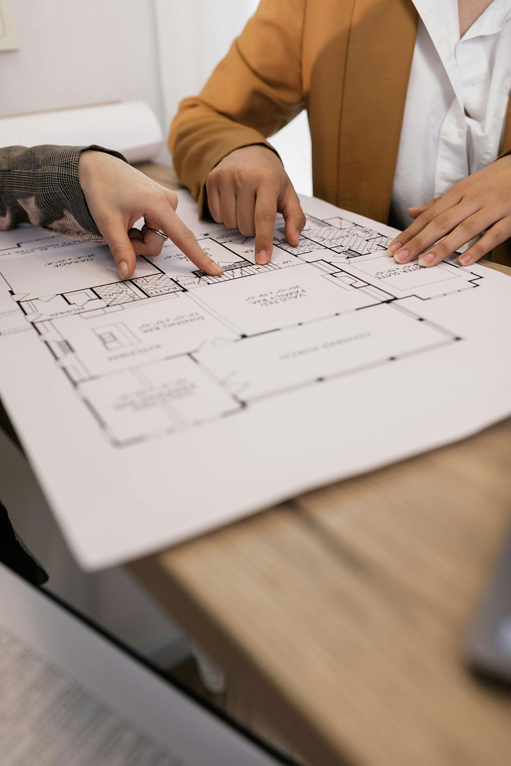 An image of a people reviewing housing plans.