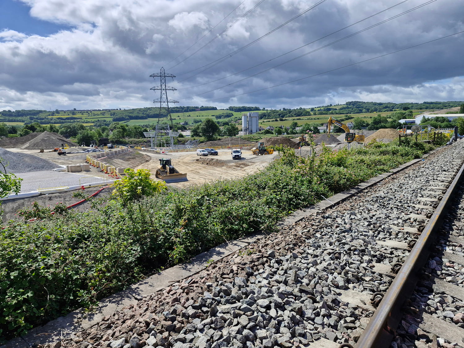 An image of building site with railway tracks.