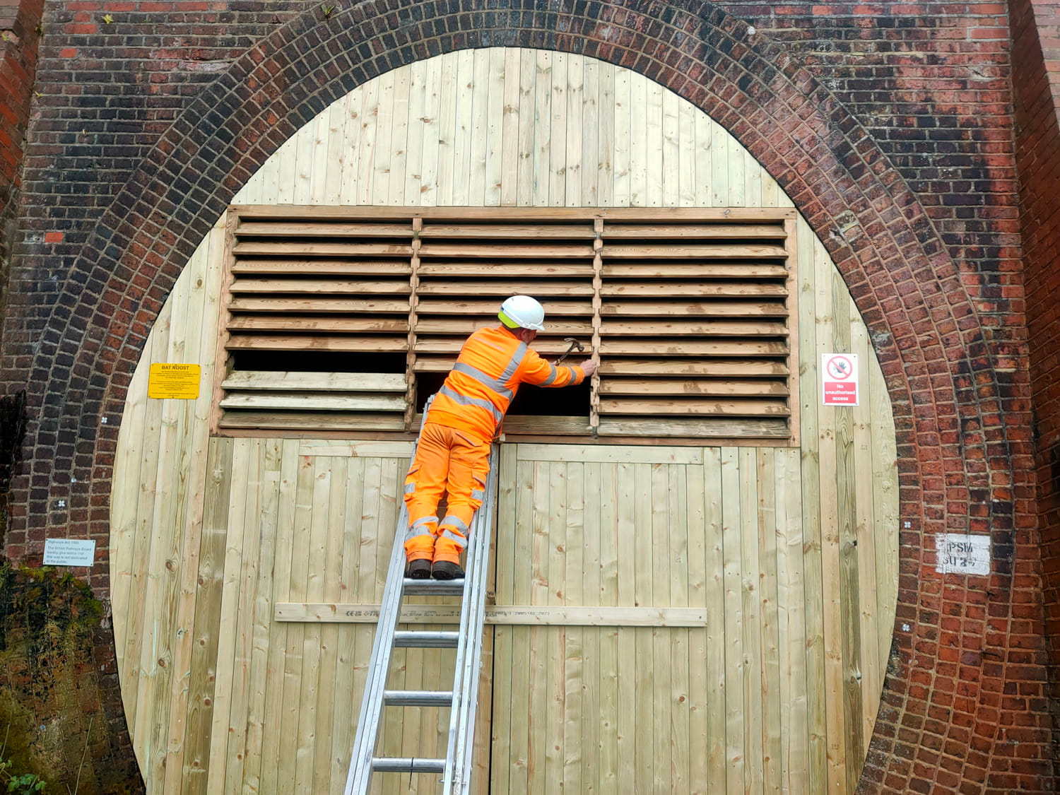 An image of worker carrying out maintenance.